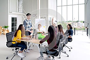 Group of young asian creative team talking, smile and laugh brainstorming, sharing or training on meeting or workshop at office.