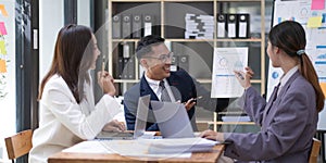 Group of young asian modern people in smart casual wear having a brainstorm meeting. Group of young asian business