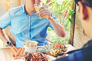 Group of young asian people celebrating beer festivals happy while enjoying home party