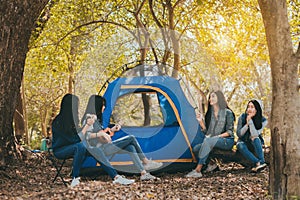 Group of Young Asian women camping and resting at forest