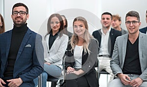 Group of young business people applauding together