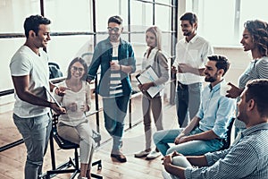 Group of Young Business People on Break in Office