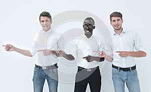 Group of young business people pointing to a copy of the space