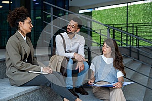 Group of young business people product strategy experts waiting for staff meeting with employer from human resources for job