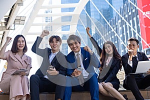 Group of young business people smiling and looking at camera with success concept