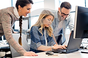 Group of business people and software developers working as a team in office