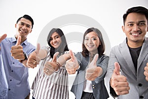 Group of young business people thumb up