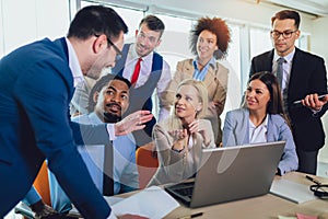 Young business people working together in creative office. Selective focus