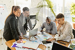 Group of young business professionals having a meeting, creative office