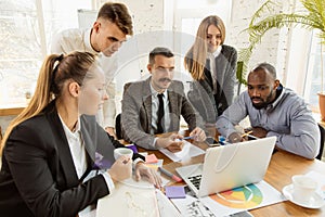 Group of young business professionals having a meeting, creative office