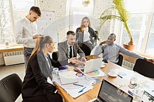 Group of young business professionals having a meeting, creative office