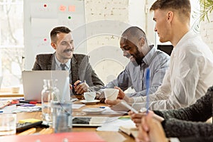 Group of young business professionals having a meeting, creative office