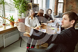 Group of young business professionals having a meeting, creative office