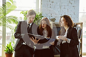 Group of young business professionals having a meeting, creative office