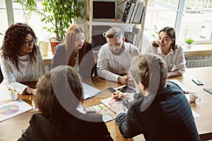 Group of young business professionals having a meeting, creative office