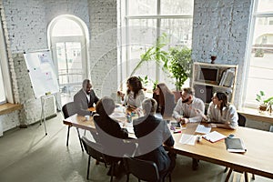 Group of young business professionals having a meeting, creative office