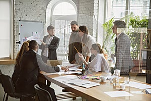 Group of young business professionals having a meeting, creative office