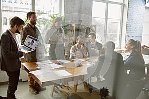 Group of young business professionals having a meeting, creative office