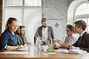 Group of young business professionals having a meeting, creative office