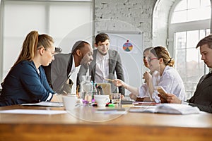 Group of young business professionals having a meeting, creative office