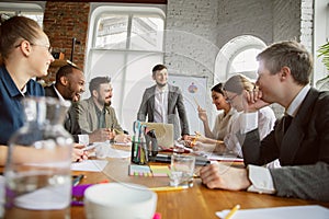 Group of young business professionals having a meeting, creative office