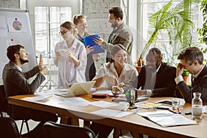 Group of young business professionals having a meeting, creative office