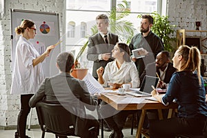 Group of young business professionals having a meeting, creative office