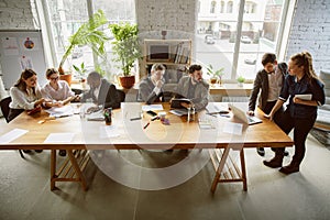 Group of young business professionals having a meeting, creative office