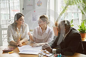 Group of young business professionals having a meeting, creative office