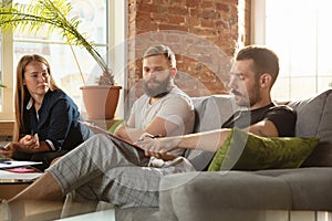 Group of young caucasian office workers have creative meeting to discuss new ideas