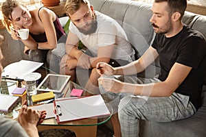 Group of young caucasian office workers have creative meeting to discuss new ideas