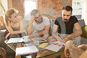 Group of young caucasian office workers have creative meeting to discuss new ideas