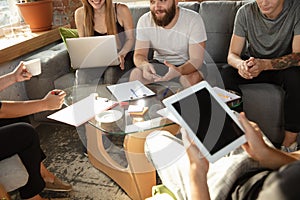 Group of young caucasian office workers have creative meeting to discuss new ideas