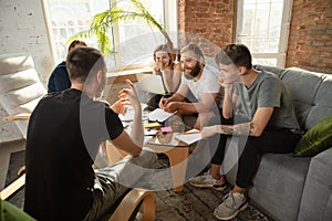 Group of young caucasian office workers have creative meeting to discuss new ideas