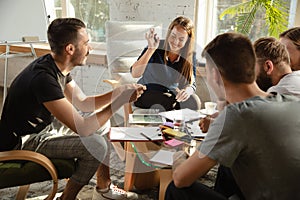 Group of young caucasian office workers have creative meeting to discuss new ideas