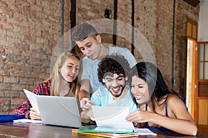 Group of young caucasian students learning together