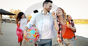 Group of young cheerful people bonding to each other and smiling