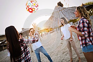 Group of young cheerful people bonding to each other and smiling