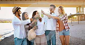 Group of young cheerful people bonding to each other and smiling