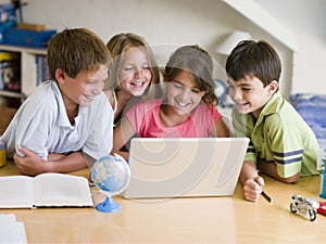 Group Of Young Children Doing Their Homework