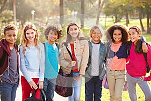 Group Of Young Children Hanging Out In Park