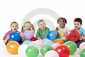 Group Of Young Children In Studio With Balloons