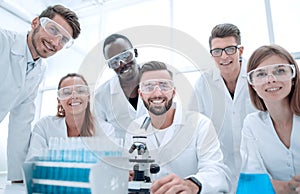 Group of young clinicians experimentation in research laboratory