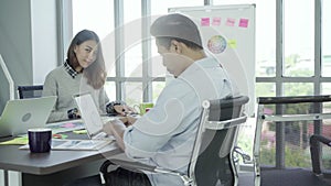 Group young coworkers together discussing creative project during work process modern colleagues in smart casual wear working.