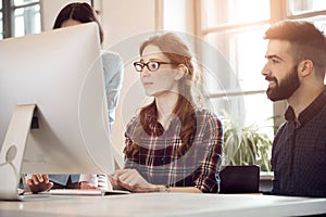 Group of young designers working as team