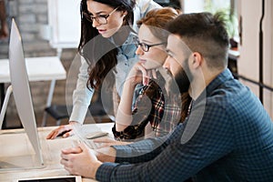 Group of young designers working as team