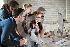 Group of young designers working as team