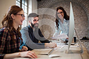 Group of young designers working as team