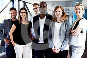 Group of young executives posing for picture