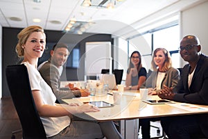 Group of young executives smiling at camera